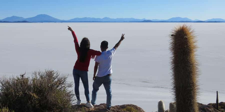 From La Paz: Trip to Uyuni Salt Flats with Wine at Sunset - Saltwater Eyes, flags, and a salt museum